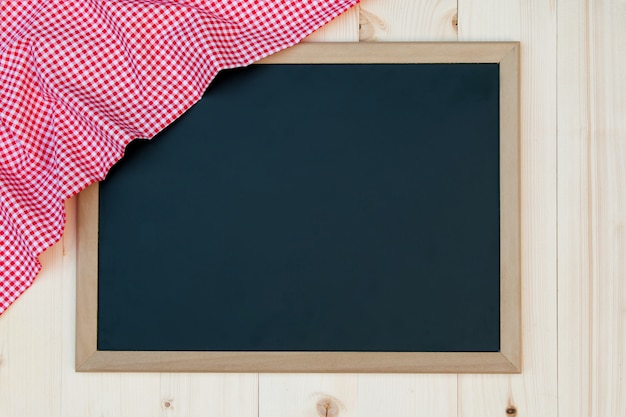 Blackboard with red checked cloth