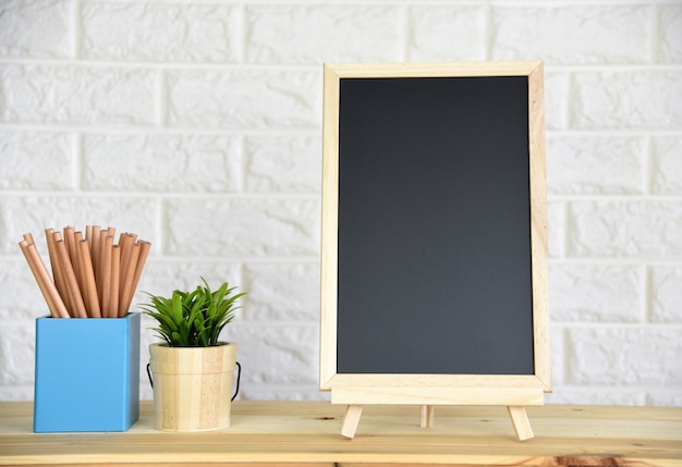 blackboard On the wood table,with space for your text.