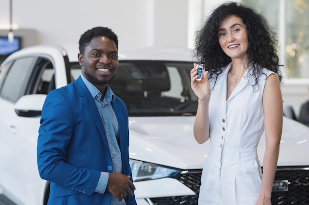 Blackhaired customer makes purchase in automobile salon