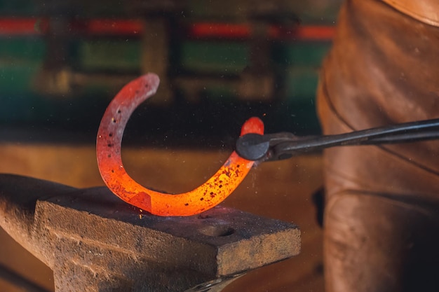 blacksmith make a horseshoe.