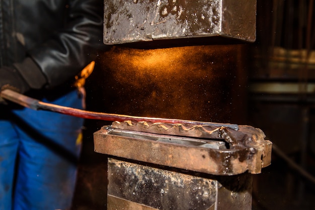 Photo blacksmith, metal processing, anvil.