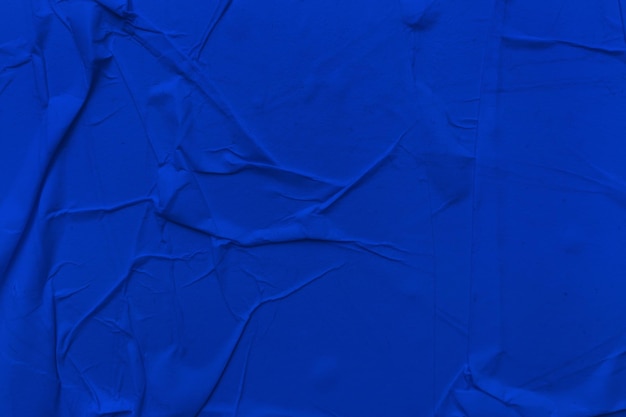 Blanco blauw papier is een verfrommelde textuurachtergrond Verfrommeld papier textuurachtergronden voor verschillende doeleinden