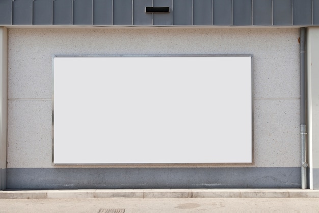 Photo blank advertising billboard on concrete wall