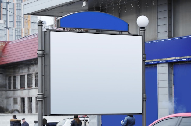 Blank advertising board on city street