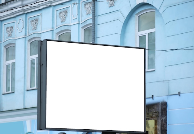 Blank advertising board on city street