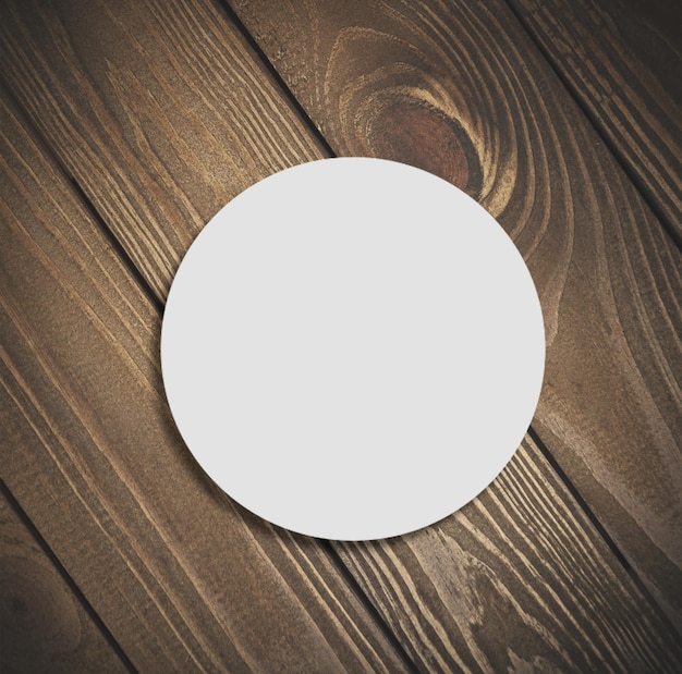 Photo blank beer coaster on vintage wooden background. flat lay.            - image