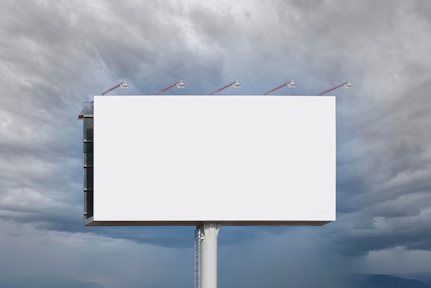 Photo blank billboard for advertising against clouds