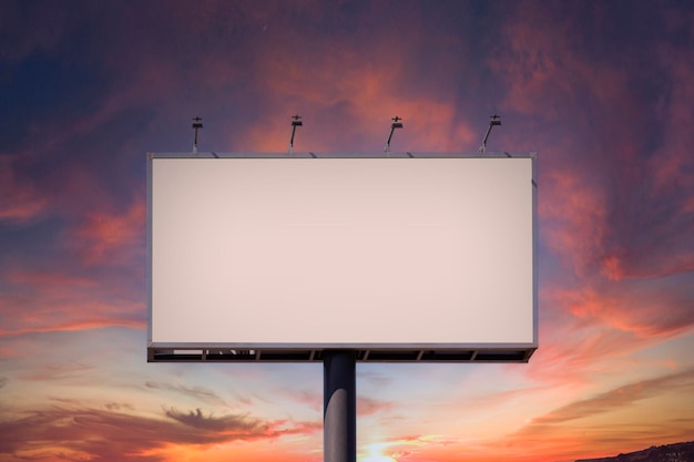 Photo blank billboard mock up for advertising against dramatic sunset sky