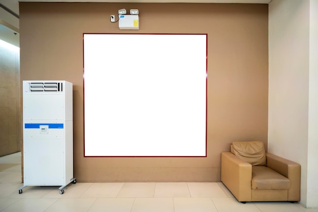 A blank billboard stuck on the wall with a sofa and air bubbles on the sides