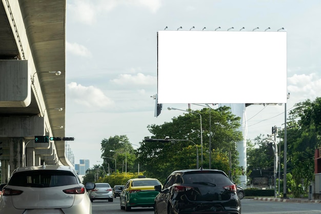 Blank billboard with copy space for text or content mockup of a blank billboard in a big city evening scene Space for your ad A blank billboard on one of Thailand's streets