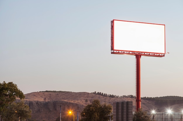 Photo blank billboards for outdoor advertising near the mountains