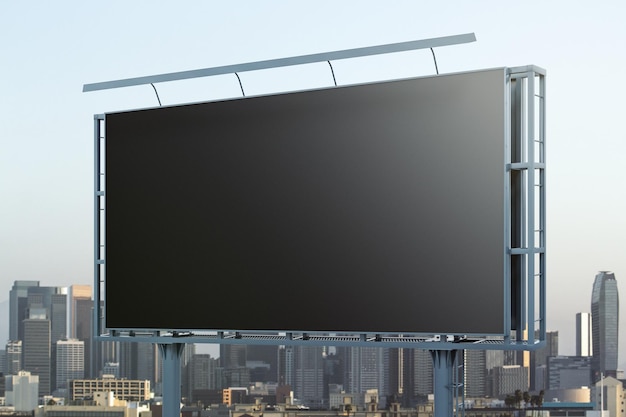 Blank black billboard on city buildings background perspective view mockup advertising concept