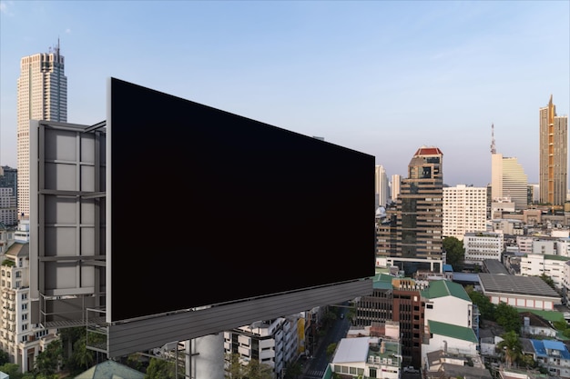 Blank black road billboard with bangkok cityscape background at
day time street advertising poster mock up 3d rendering side view
the concept of marketing communication to promote or sell idea