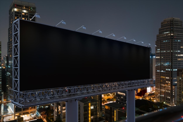 Blank black road billboard with bangkok cityscape background at\
night time street advertising poster mock up 3d rendering side view\
the concept of marketing communication to promote idea