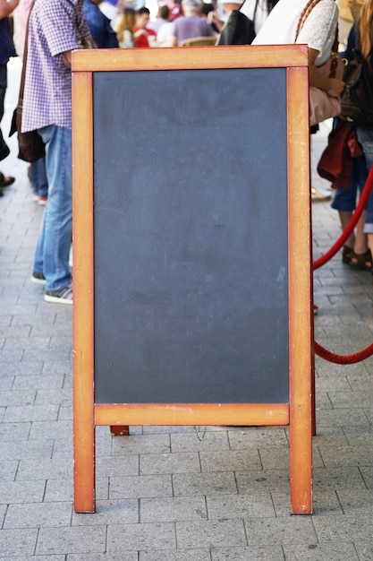 Photo blank blackboard advertising sign or customer stopper