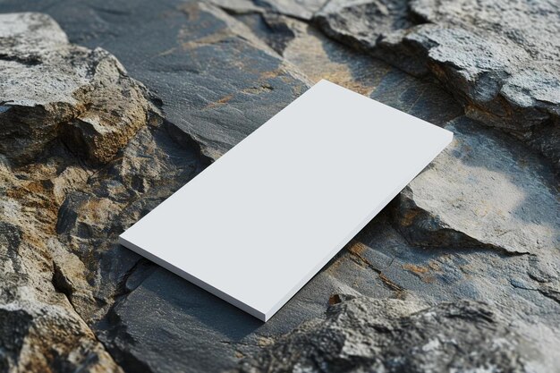 a blank book sitting on top of a rock