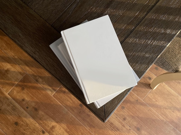 blank books on wooden table