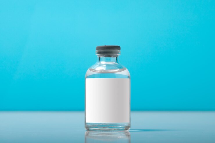 Blank bottle vial of Covid19 coronavirus vaccine on background of covid19 quarantine