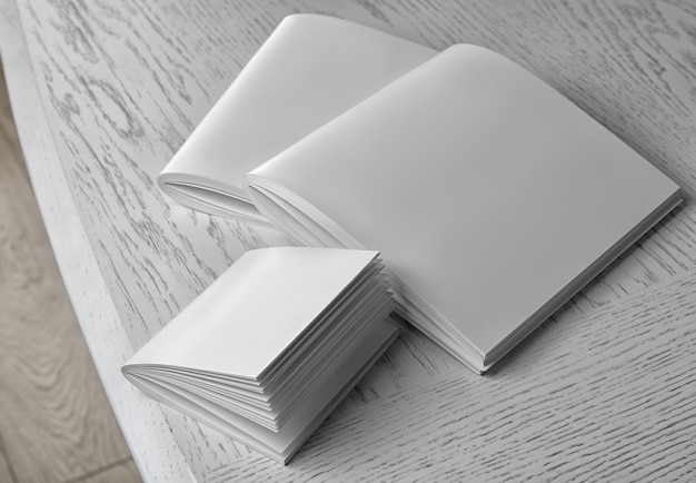 Blank brochures on wooden table