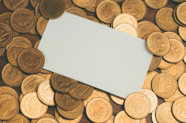 Blank business card or name card with stack of coin