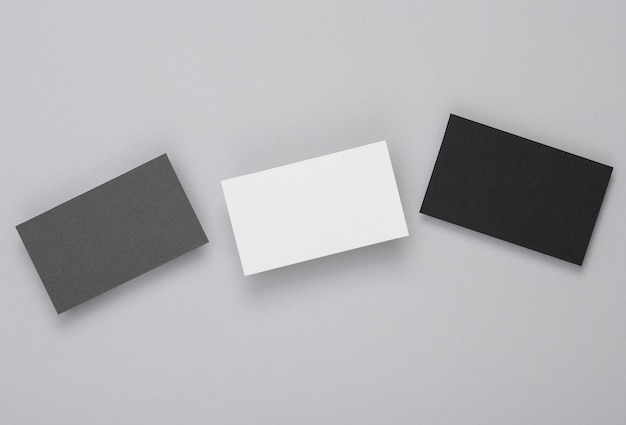 Blank business cards for branding on a gray background