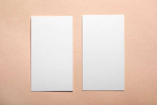 Blank business cards on color background