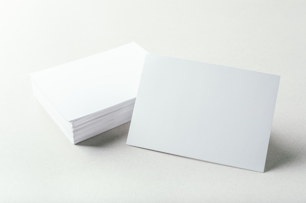 Blank business cards on grey background