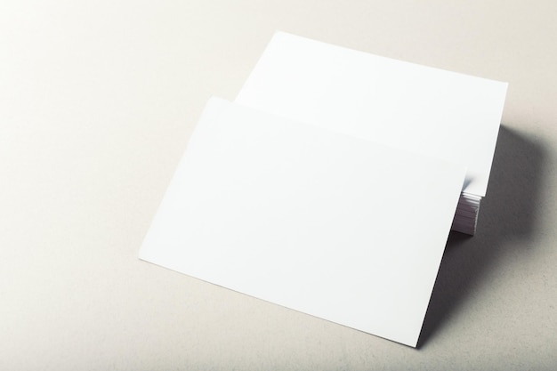 Blank business cards on grey background