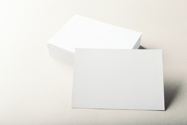 Photo blank business cards on grey background