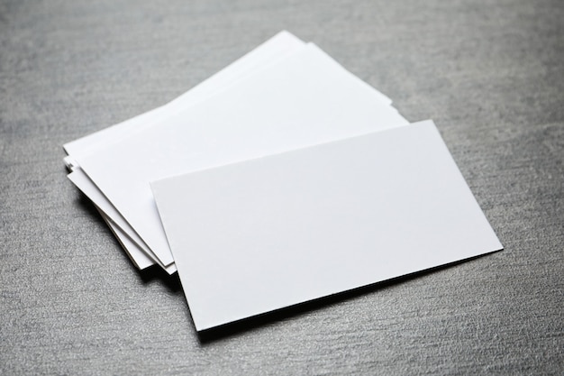 Blank business cards on grey table