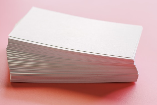 Blank business cards on pink background