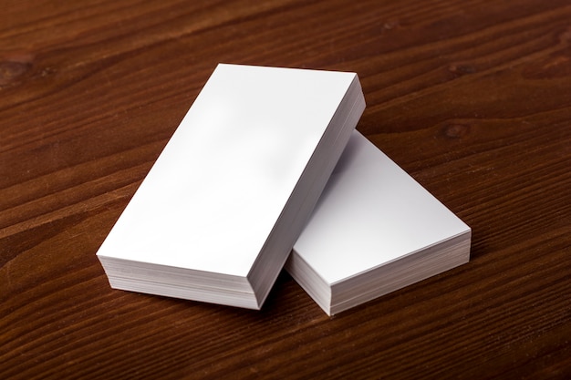 Blank business cards on a wooden background