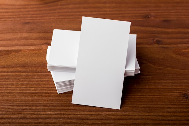 Blank business cards on a wooden background