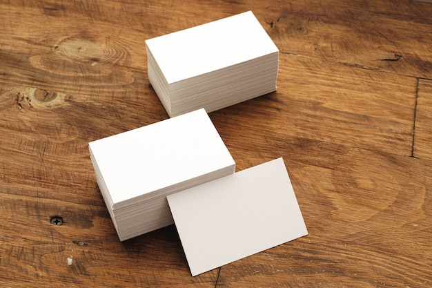 Blank businesscard stacks on rough wooden table