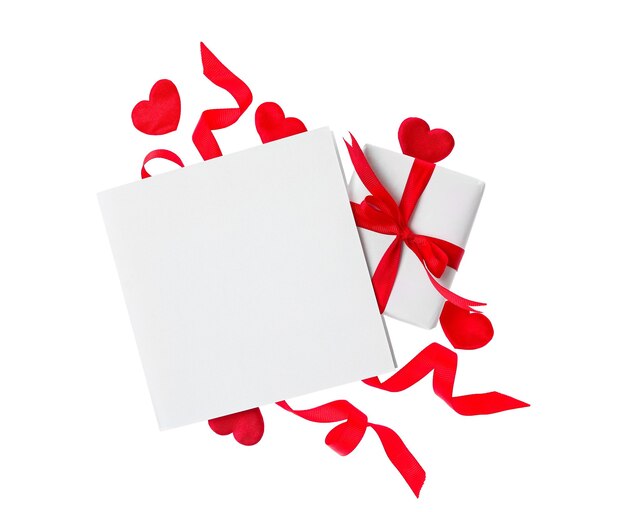 Blank card gift box and red decorative hearts on white background top view Valentine's Day celebration