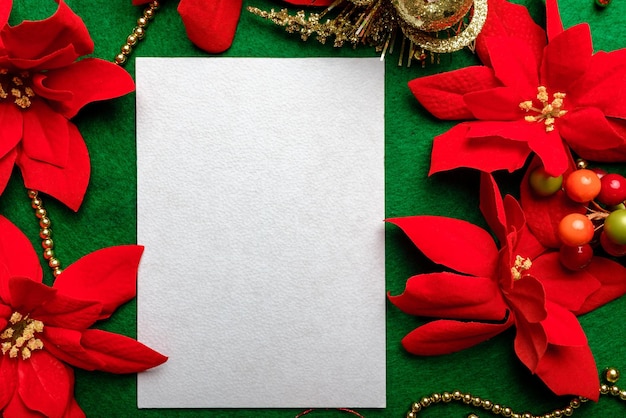 Blank card with Christmas decorations and poinsettia