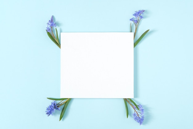 Blank card with frame made of snowdrop flowers