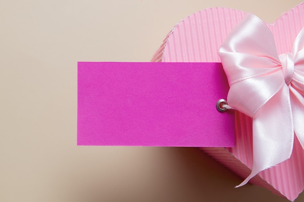 Photo blank card with pink heart shaped gift box and bow