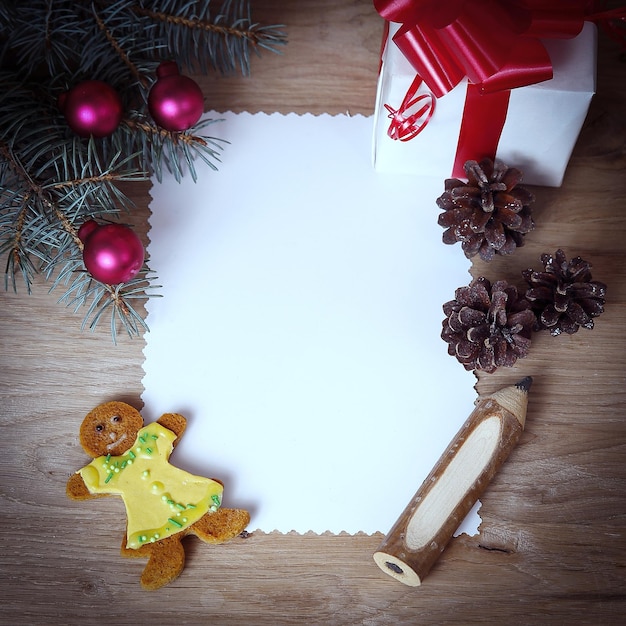 Blank Christmas card and a box with gift on Christmas background