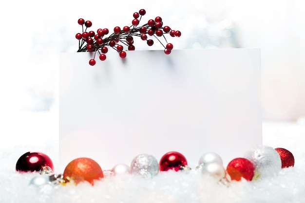 Photo blank christmas card and red baubles