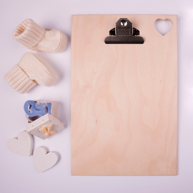 Photo blank clipboard and baby socks