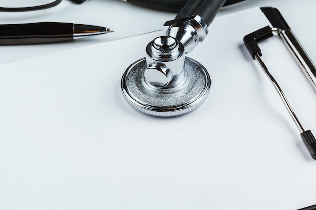 blank clipboard with modern stethoscope