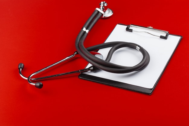 blank clipboard with modern stethoscope