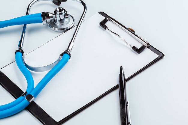 Blank clipboard with modern stethoscope