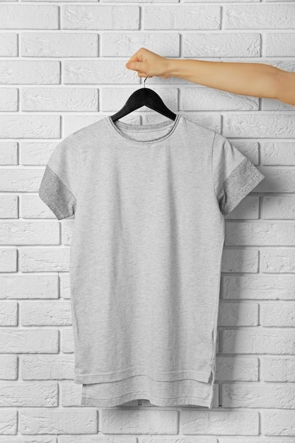 Blank color tshirt against brick wall