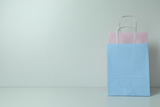 Blank colorful paper bags on white