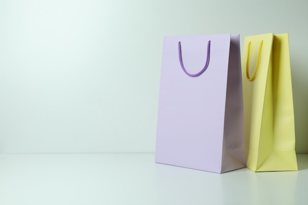 Blank colorful paper bags on white