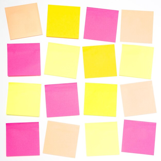 Photo blank colourful sticky notes on a white background ready for personal messages with copy space