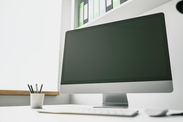 Blank computer screen on a desktop mockup 3D Rendering