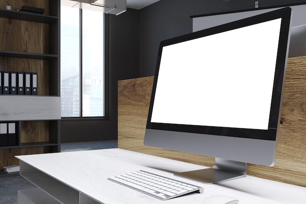 Blank computer screen standing on a white table in a modern office with bookshelves. 3d rendering mock up